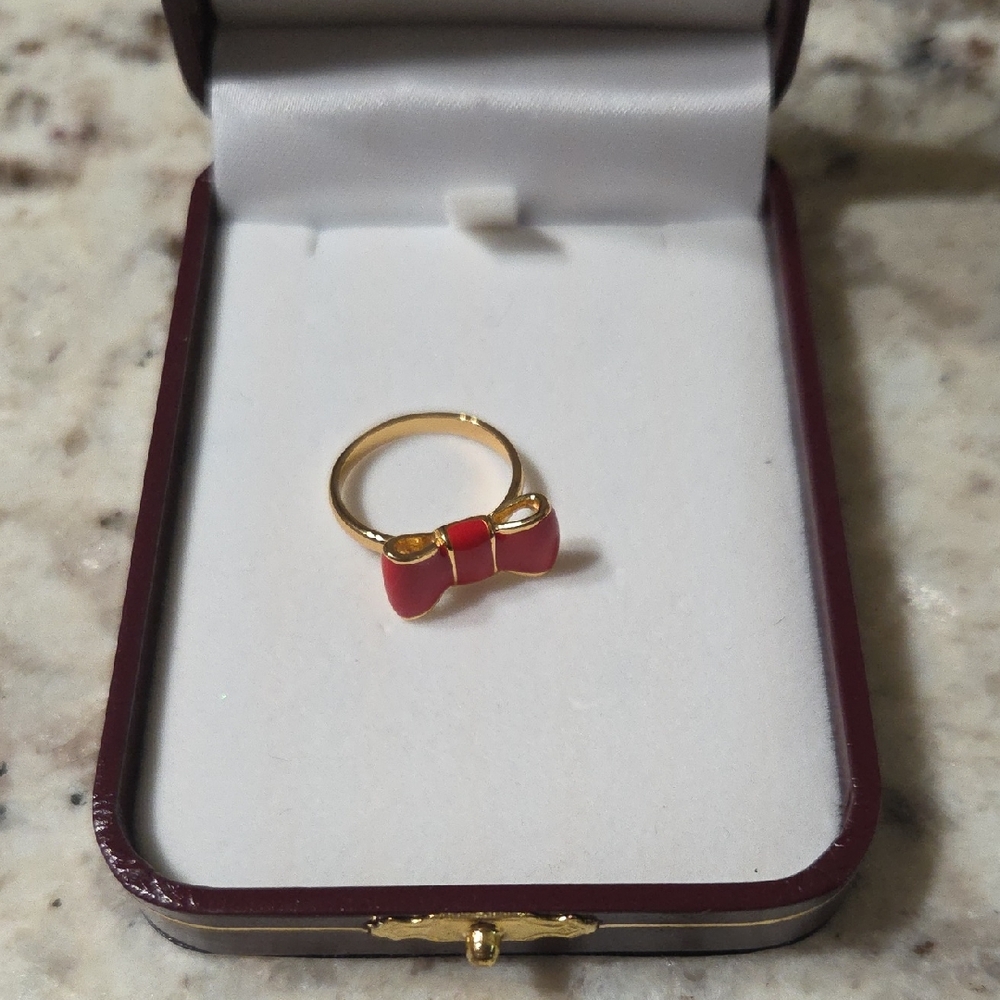 Gold Tone Ring with Red Bow Accent - Women's Jewelry